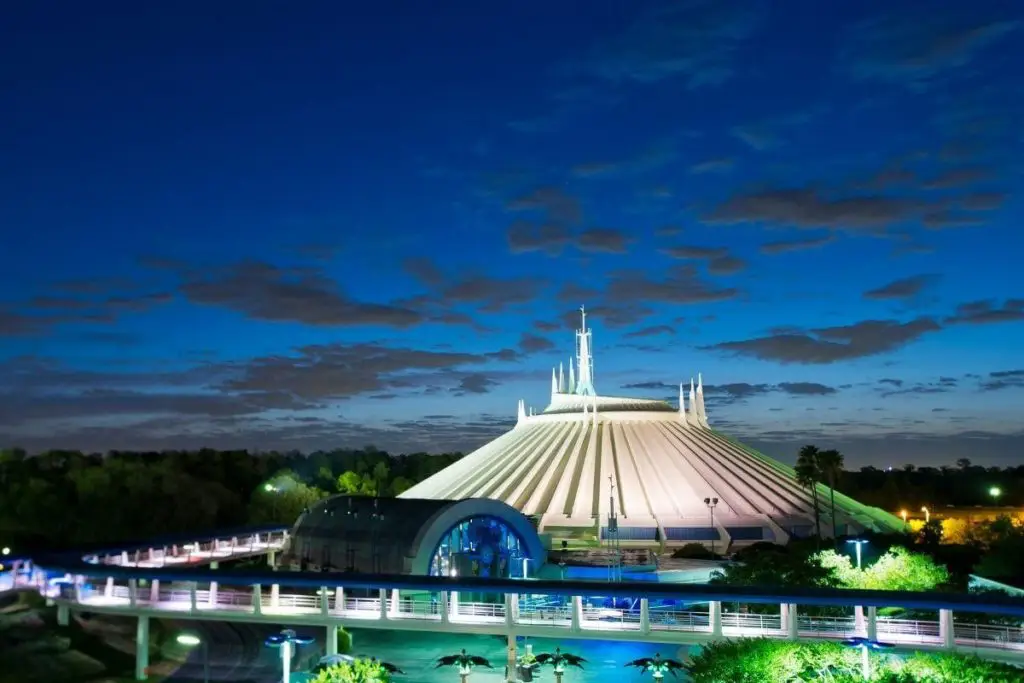 Photo of the exterior of Space Mountain roller coaster at night.