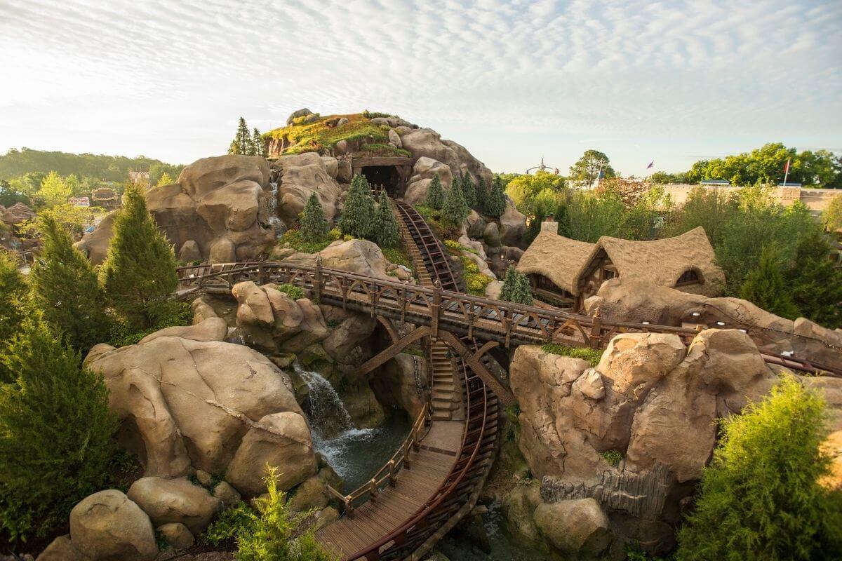 Landscape view of a section of the Seven Dwarfs Mine Train roller coaster at Disney World's Magic Kingdom.