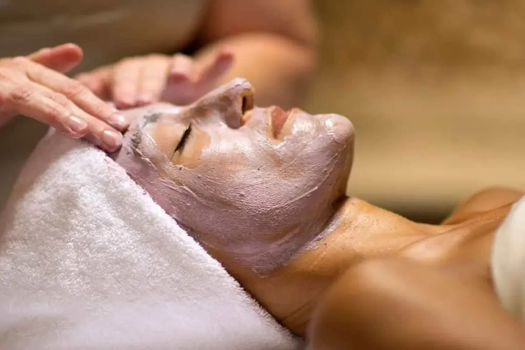 Closeup of a woman getting a facial at a spa.