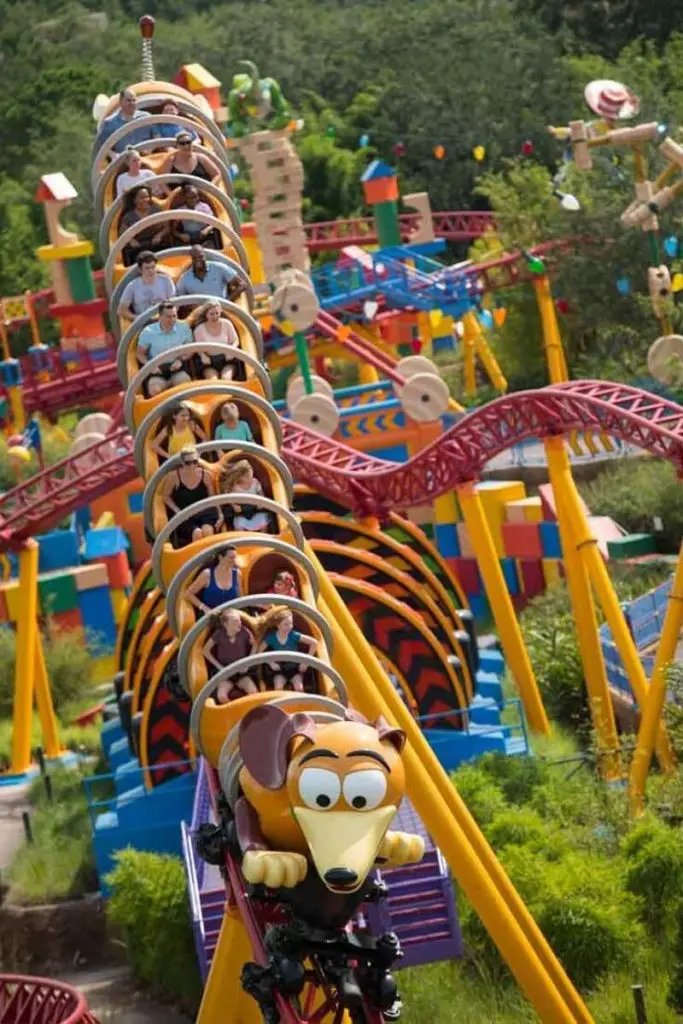Photo of guests riding Slinky Dog Dash roller coaster at Disney World's Hollywood Studios.