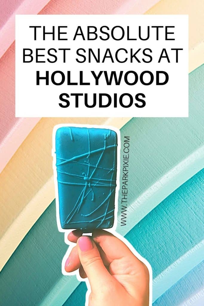 Closeup of a key lime pie on a stick in front of a pastel rainbow wall. Text at the top reads "The Absolute Best Snacks at Hollywood Studios."