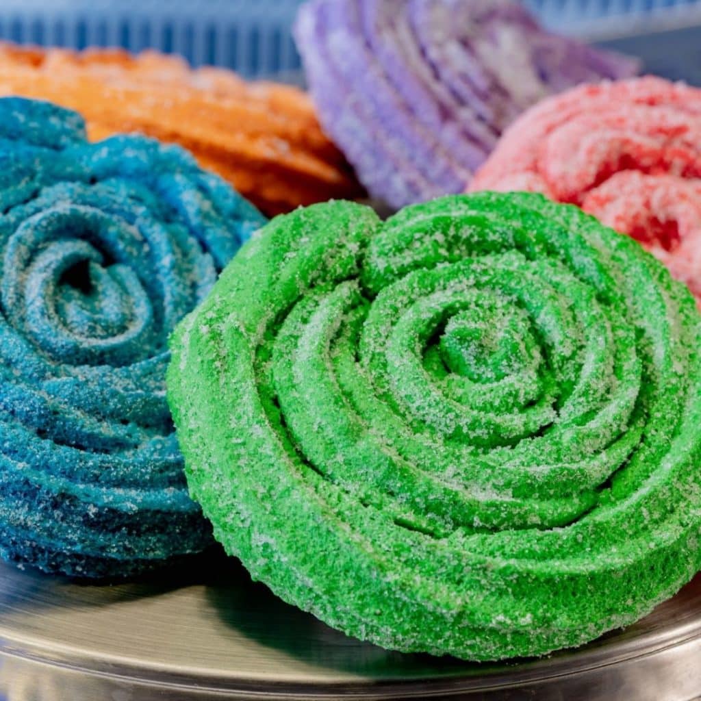 Closeup of brightly colored Sweet Spiral Ration Churros from Terran Treats at the Avengers Campus at Disney California Adventure Park.