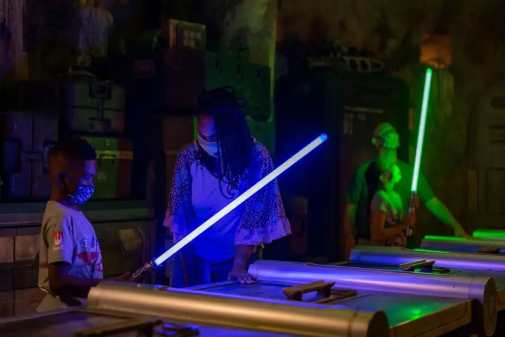Photo of people making a light saber at Disney's Hollywood Studios.