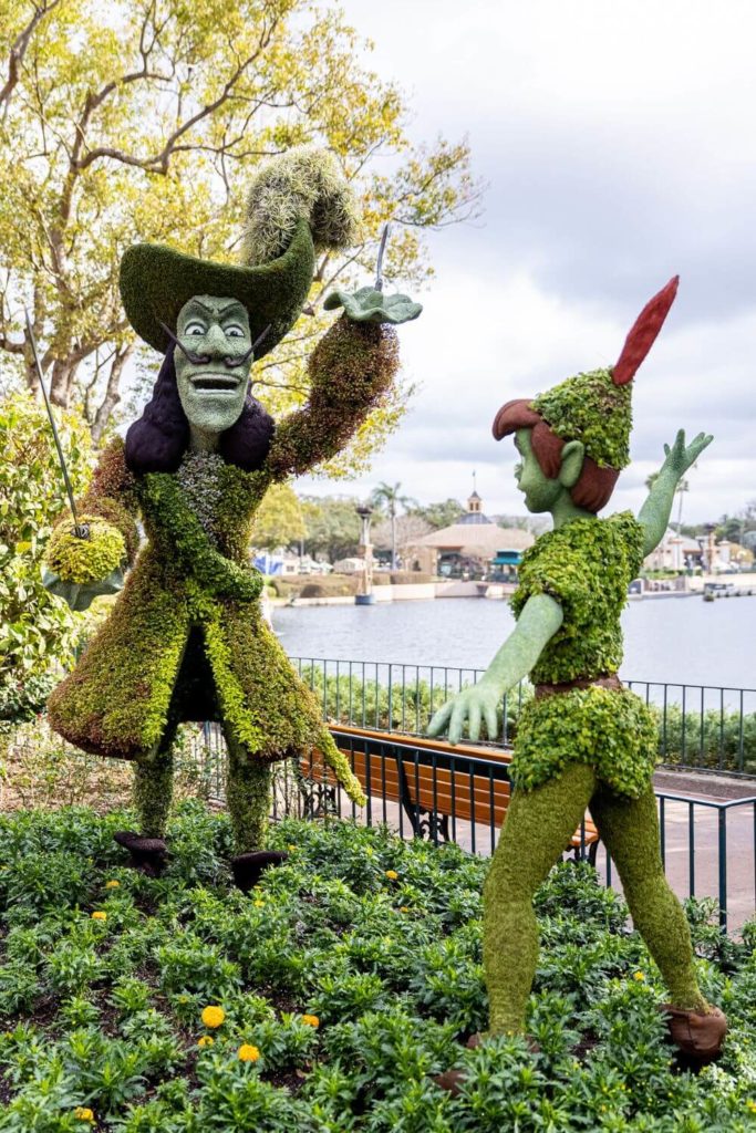 Photo of 2 topiaries that look like Captain Hook and Peter Pan at Disney World's Epcot International Flower and Garden Festival.