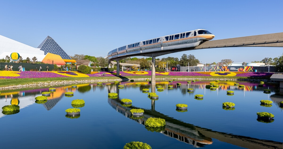 Photo of the monorail at Epcot with lots of floral displays.