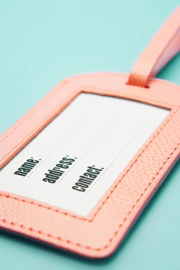 Closeup photo of a pink luggage tag.
