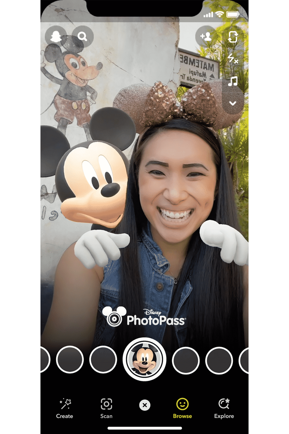 Screenshot of a woman using the Disney x Snap Mickey Mouse filter.