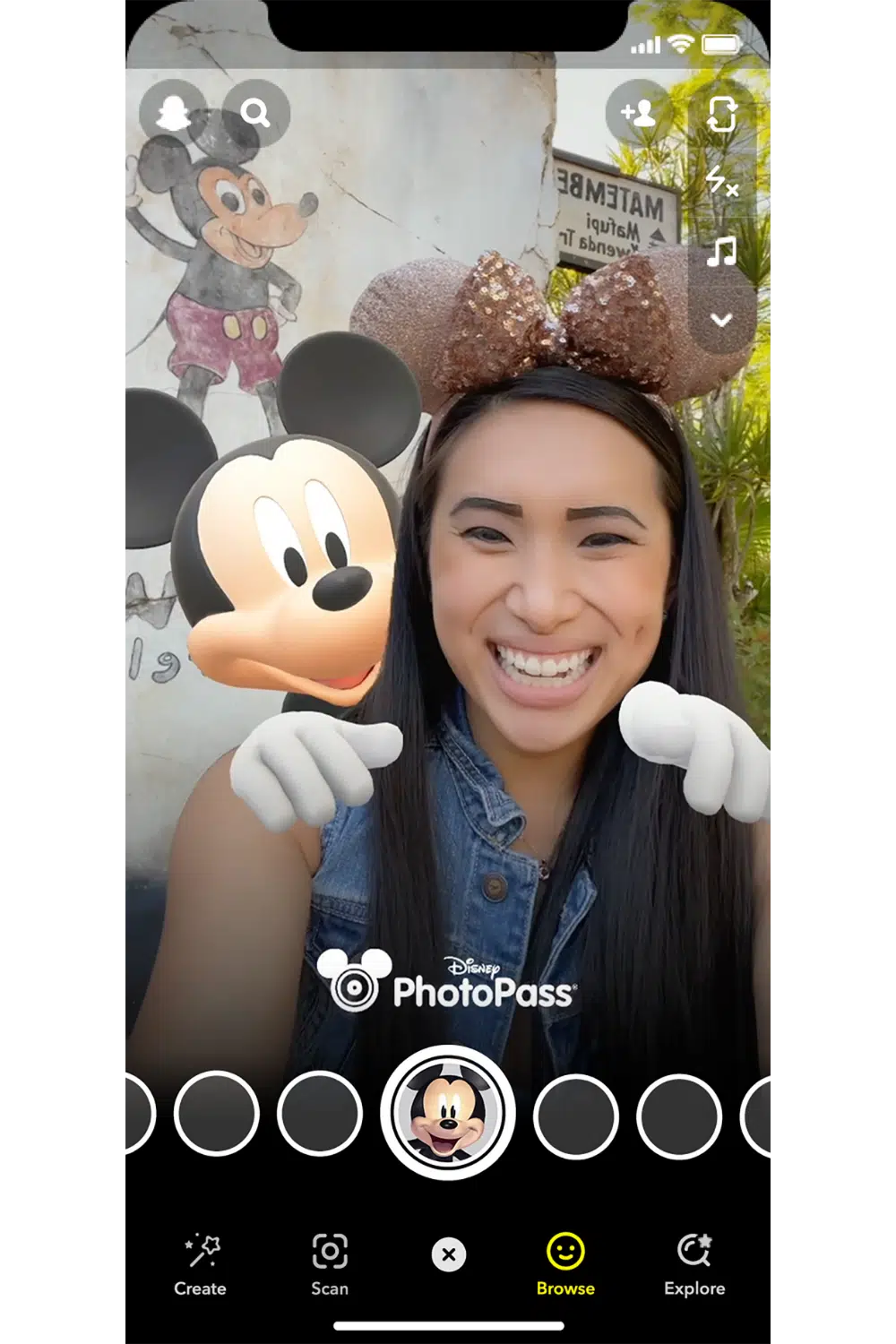 Screenshot of a woman using the Disney x Snap Mickey Mouse filter.