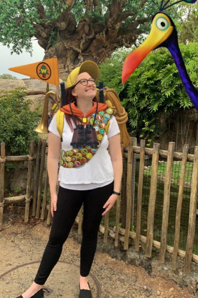Photo of a young woman decked out in Wilderness Explorers gear photo overlay and Kevin from Pixar's Up.