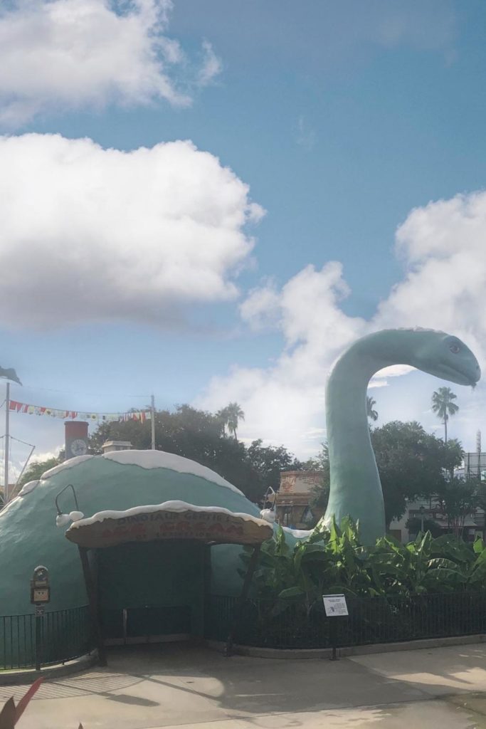 Photo of Gertie the Dinosaur at the edge of Echo Lake at Hollywood Studios.