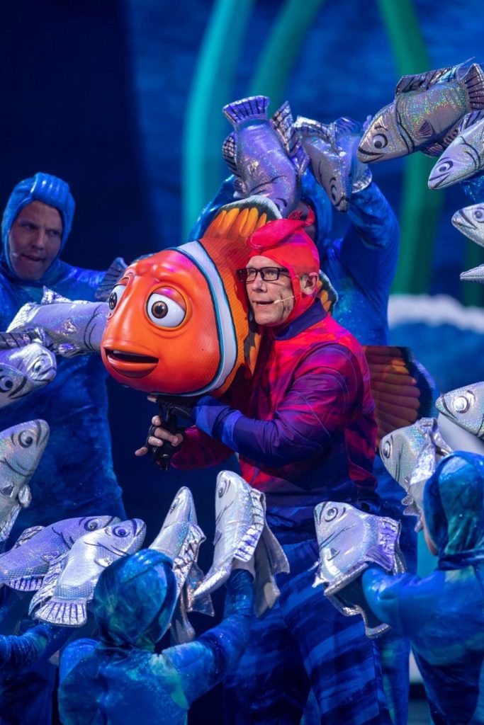 Photo of a man performing in the Nemo stage show at Animal Kingdom.
