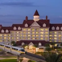 Photo of the Grand Floridian Resort at night, one of several Disney hotels on the monorail.