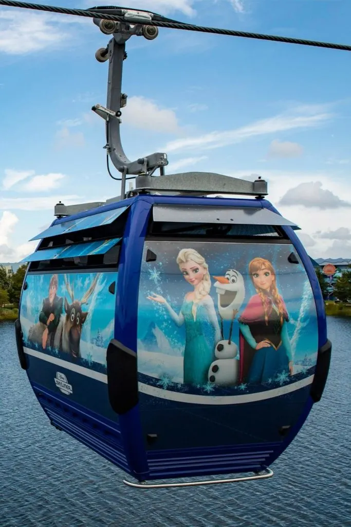 Closeup of a Disney Skyliner gondola cabin adorned with Pete from Mickey Mouse Clubhouse and Goof Troop.