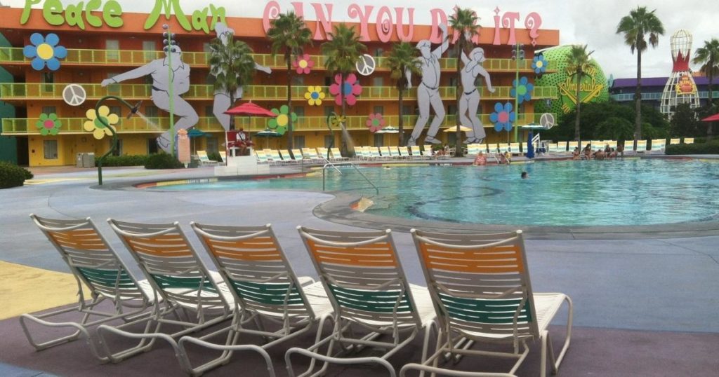 Photo of the main pool and 70s themed building at Pop Century Resort.