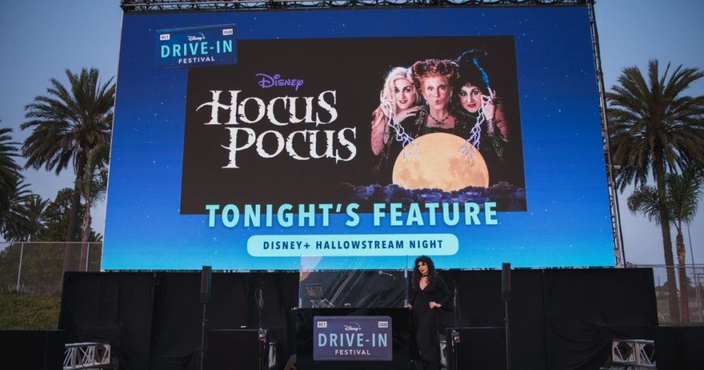 Photo of an outdoor movie screen with a promotional still for Disney's Hocus Pocus.