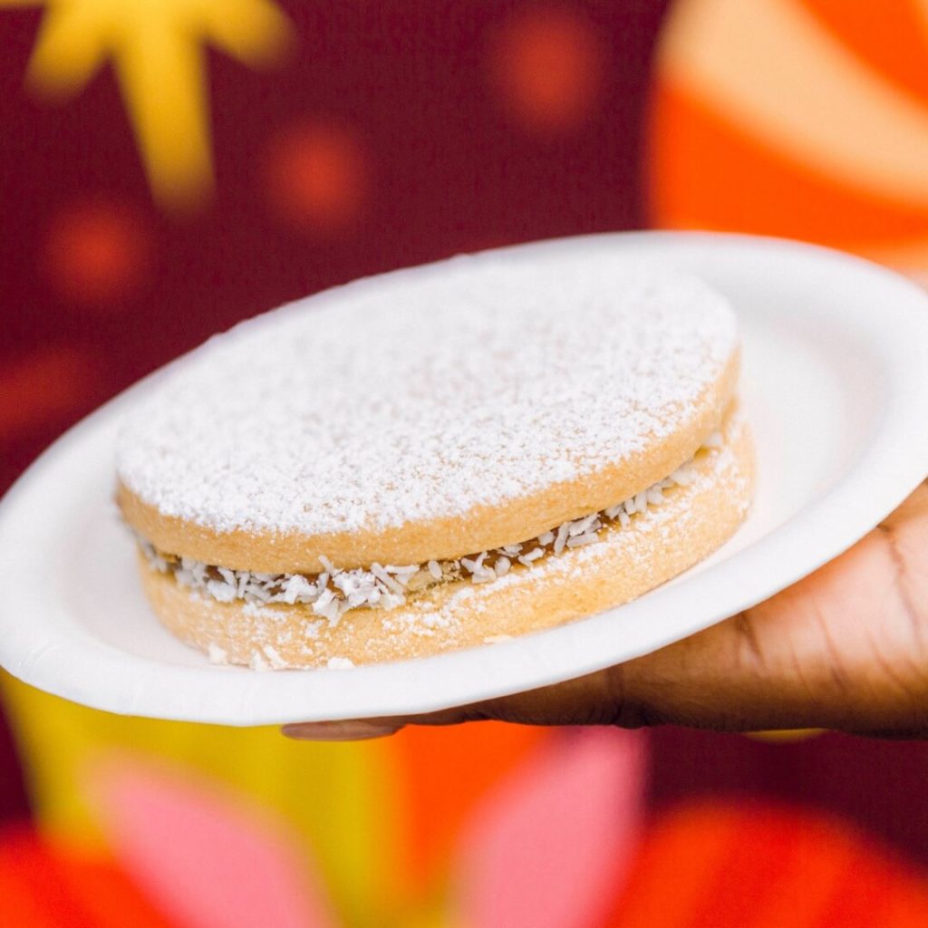 Closeup of the alfajores vanilla shortbread cookies with a dulce de leche and coconut cream filling.
