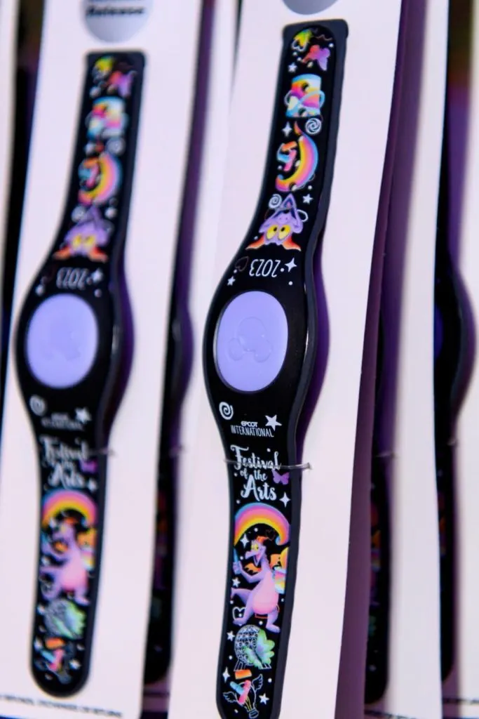 Closeup of the 2023 Epcot International Festival of the Arts MagicBand+ featuring Figment.