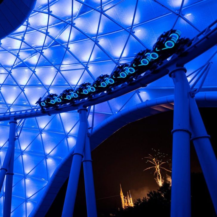 Photo of a test run of the TRON Lightcycle / Run roller coaster at Magic Kingdom at night.