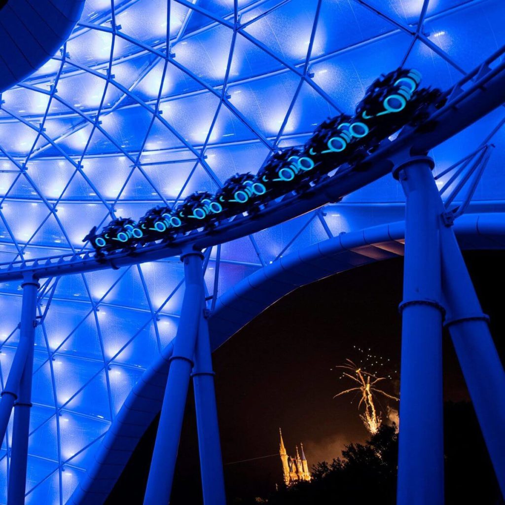 Photo of the TRON roller coaster at night.