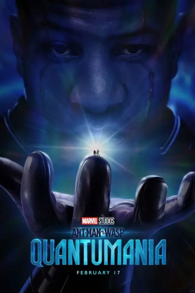 Promotional poster for the movie "Ant-Man and the Wasp: Quantumania" featuring Kang the Conqueror with 2 ant-sized characters perched on top of one of his fingers.