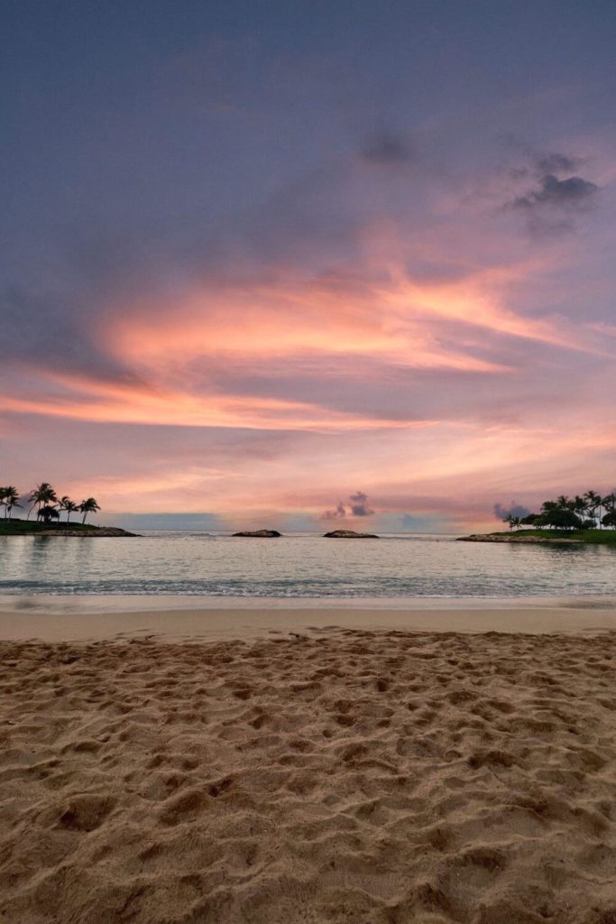 Photo of the Aulani beach lagoon at sunset.