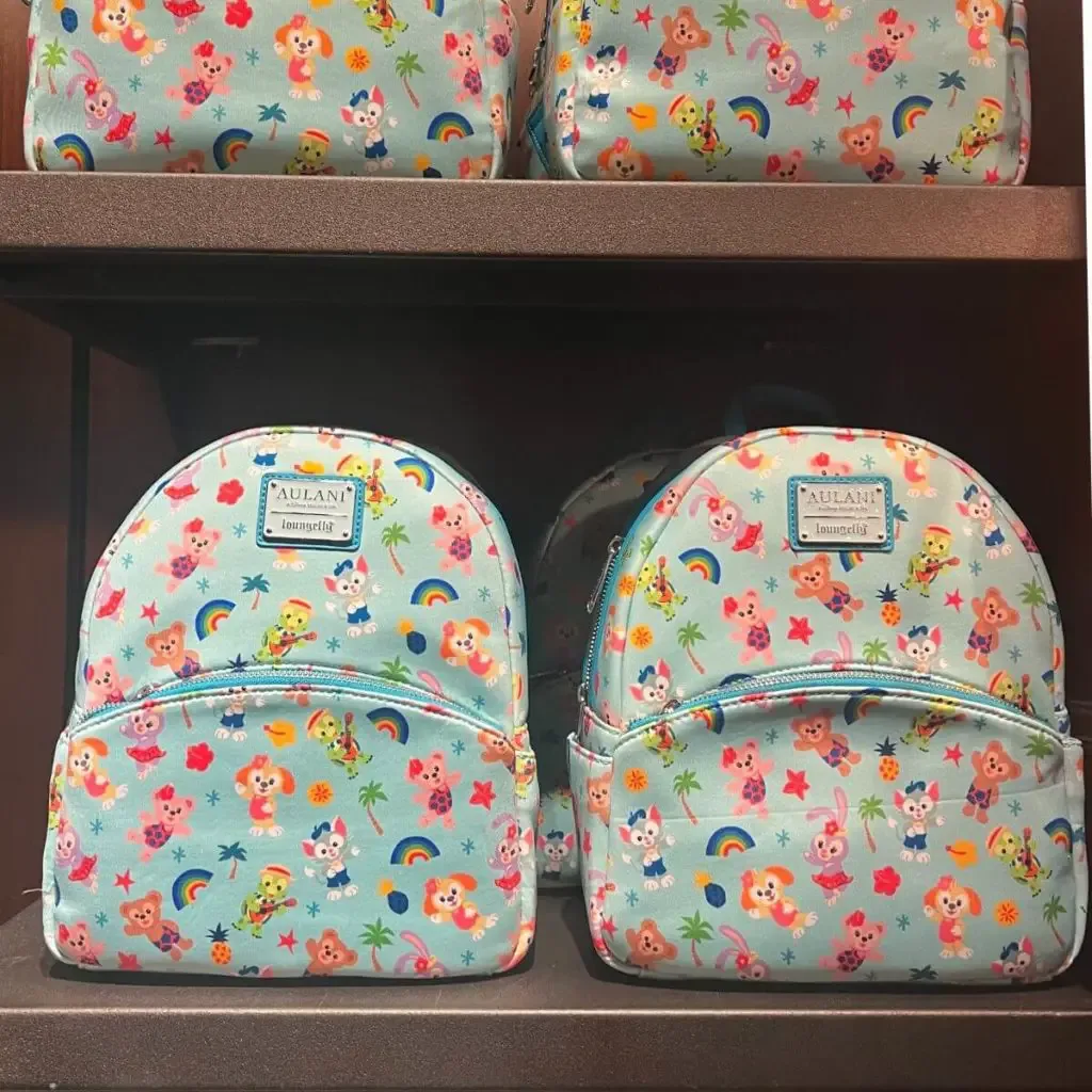 Photo of Aulani themed loungefly backpacks displayed on shelves.