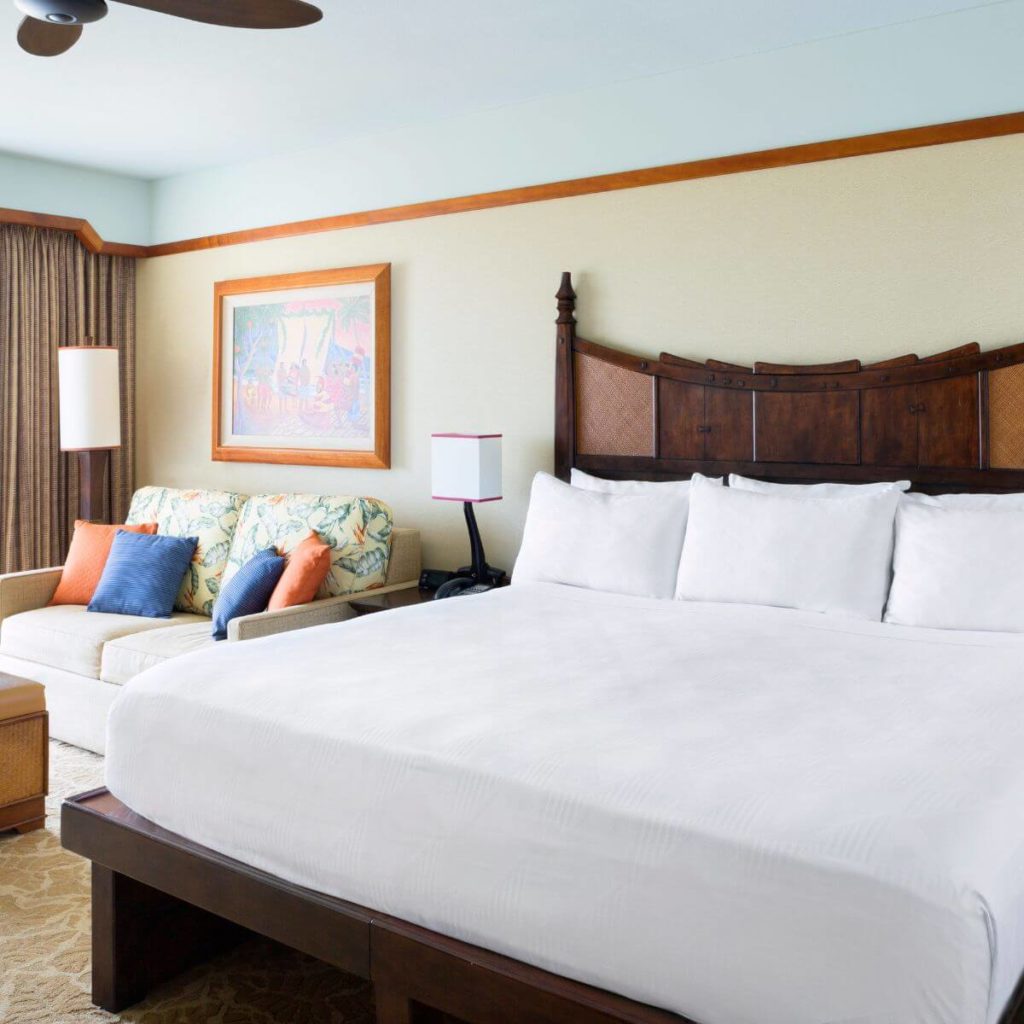 Phot of a standard room with 1 queen bed and a sofa at Aulani Disney Resort.
