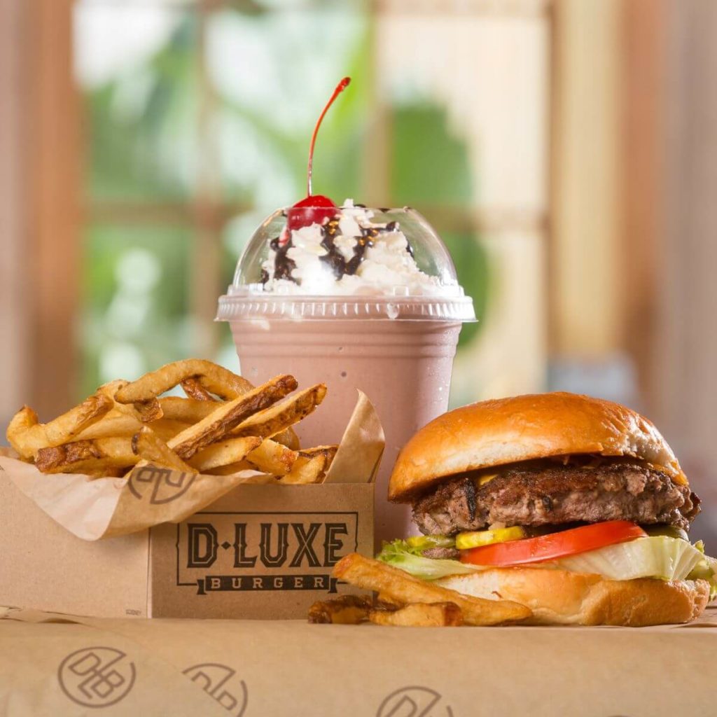 Photo of a basket of french fries, a cheeseburger, and a milkshake from D-Luxe Burger in Disney Springs.