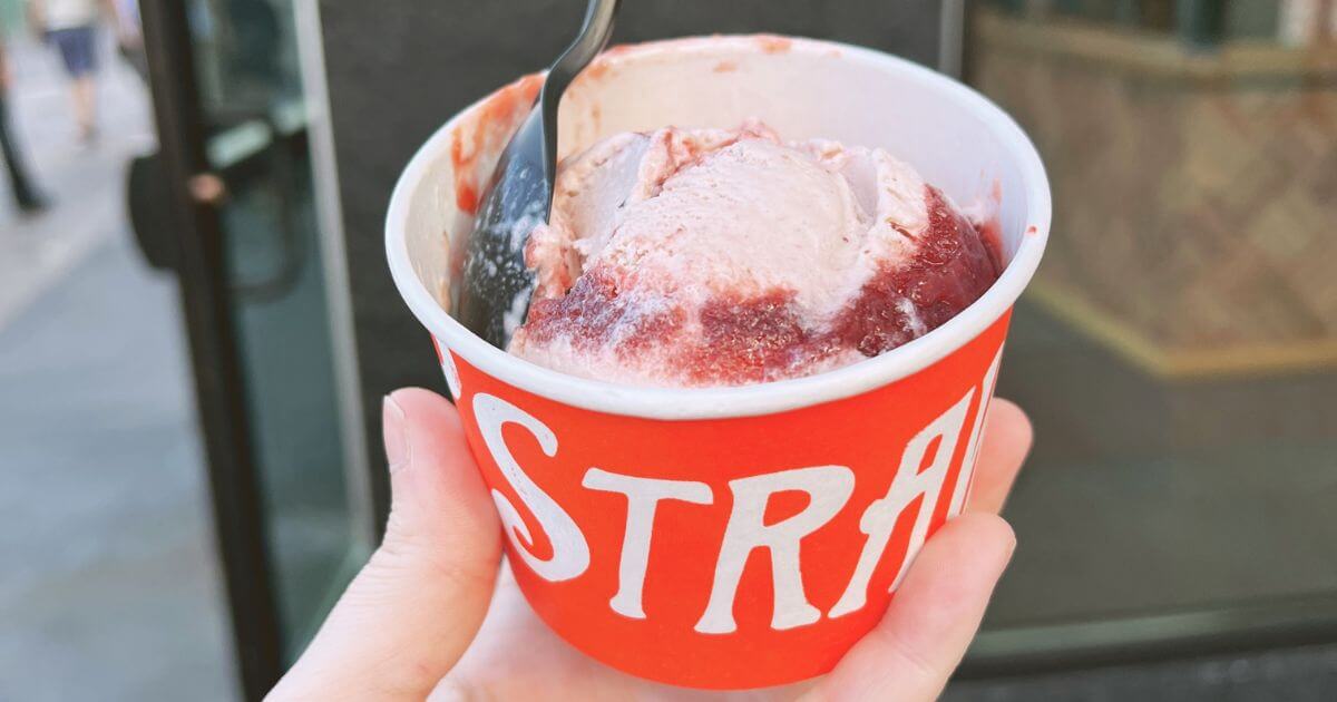 Closeup of a cup of strawberry balsamic ice cream from Salt & Straw in Disney Springs.