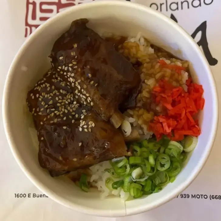 Flat lay photo with a bowl of char siu pork rice bowl from Morimoto Asia Street Food.