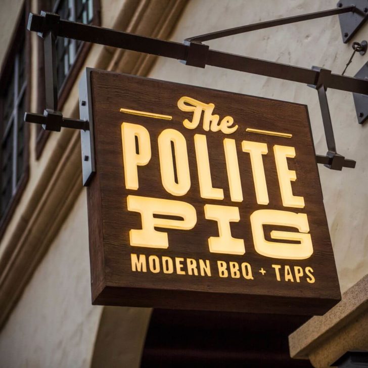 Closeup photo of the signage for The Polite Pig Modern BBQ + Taps at Disney Springs