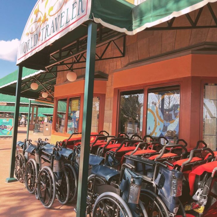 Photo of strollers and wheelchairs lined up outside the World Traveler gift shop at Epcot theme park.