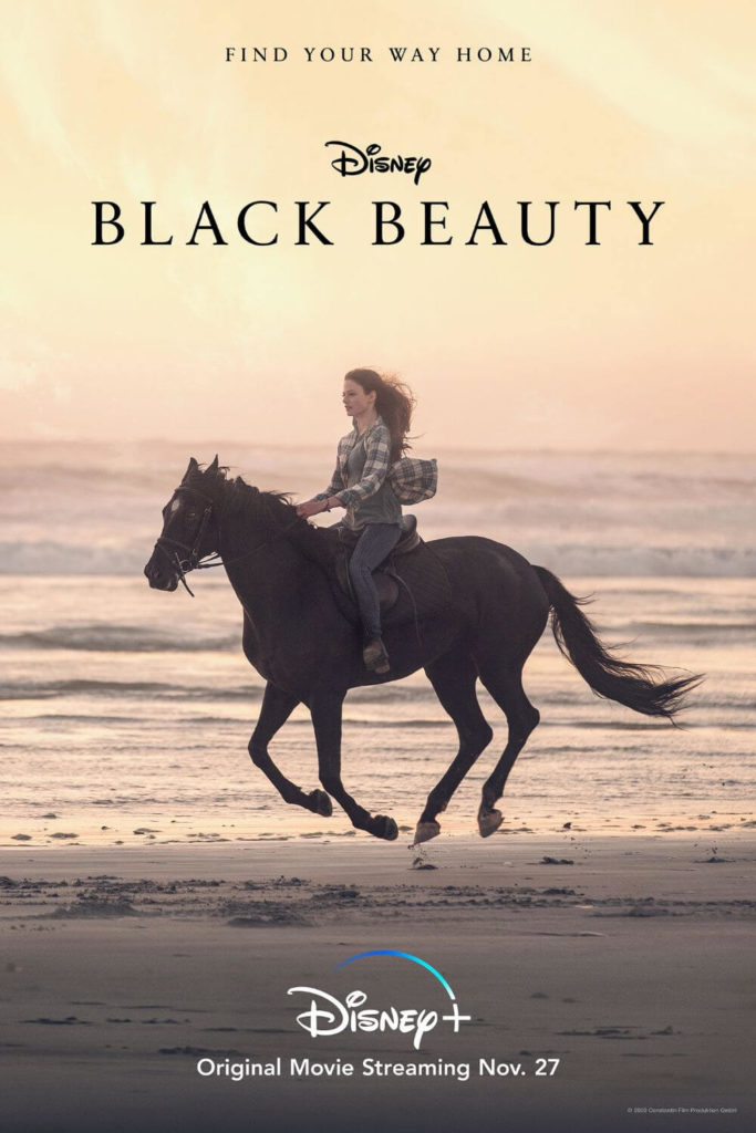 Promotional poster for the 2020 Disney film, Black Beauty, with a photo of a woman riding a horse on a beach.