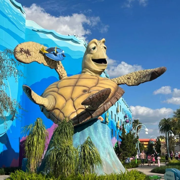 Photo of a huge Crush and Dory statue nearby the pool at Disney's Art of Animation Resort.