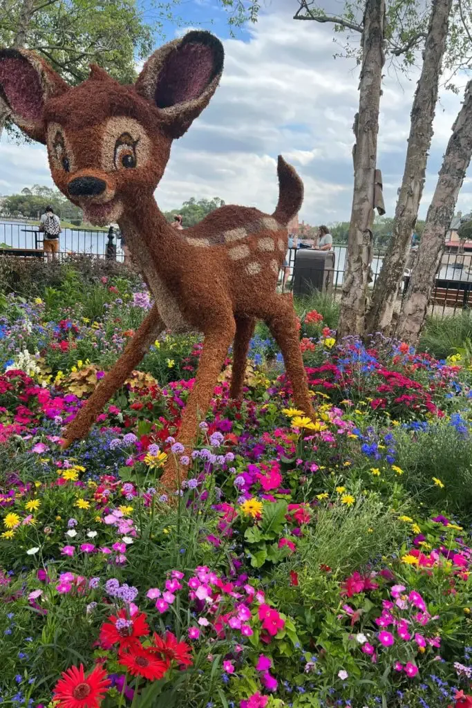 Photo of the Bambi topiary set amidst wildflowers.