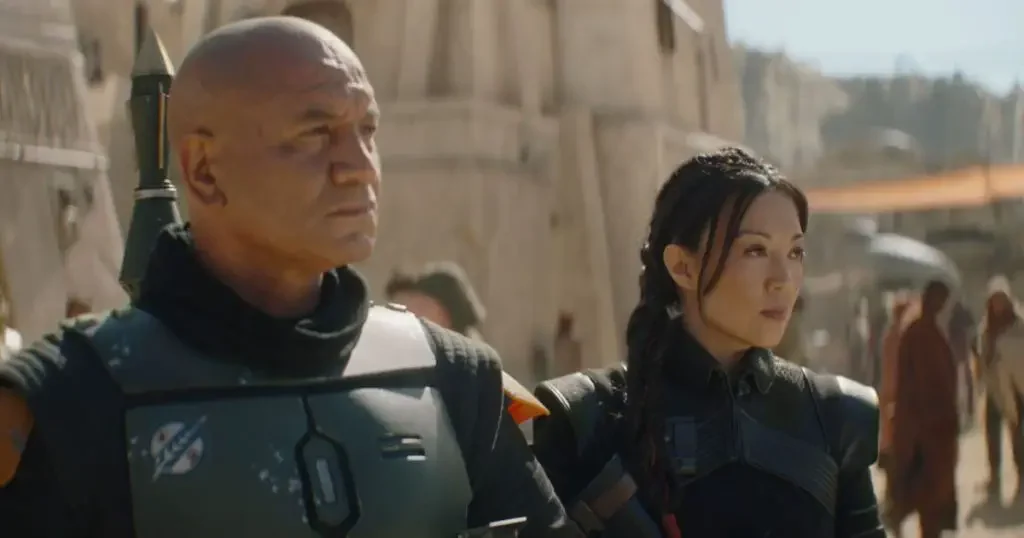 Photo still of Boba Fett and Fennec Shand as they walk around Mos Espa.