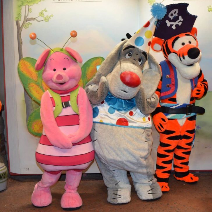 Photo of Piglet, Eeyore, and Tigger dressed in Halloween costumes.