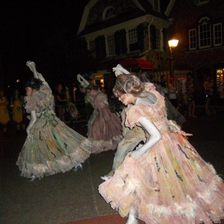 Photo of several groups of dancing ghosts from Mickey's Boo To You Parade.