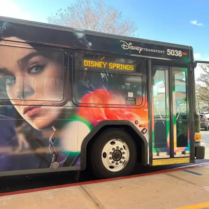 Photo of a Disney transportation bus with the location marquee set to Disney Springs.