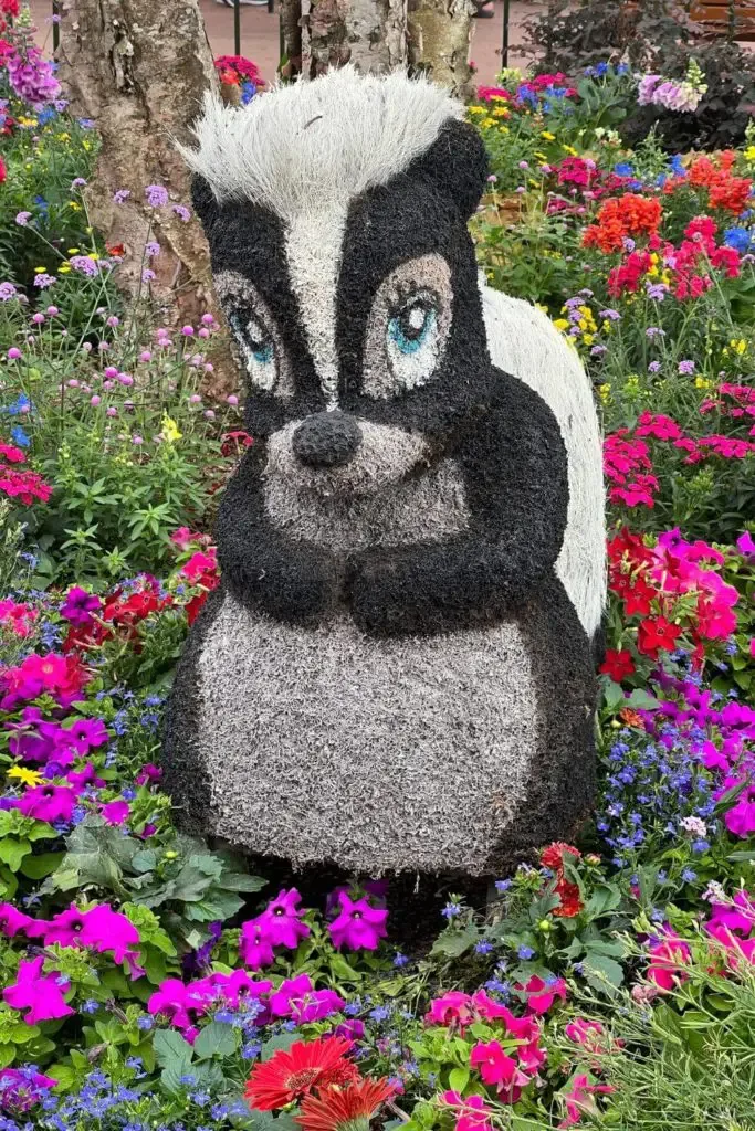 Photo of a topiary shaped like Flower, the skunk from Bambi.