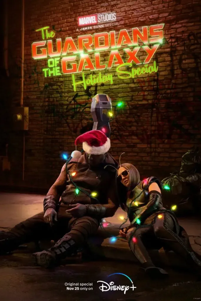 Promotional poster for The Guardians of the Galaxy: Holiday Special with Drax and Mantis passed out in an alley way.