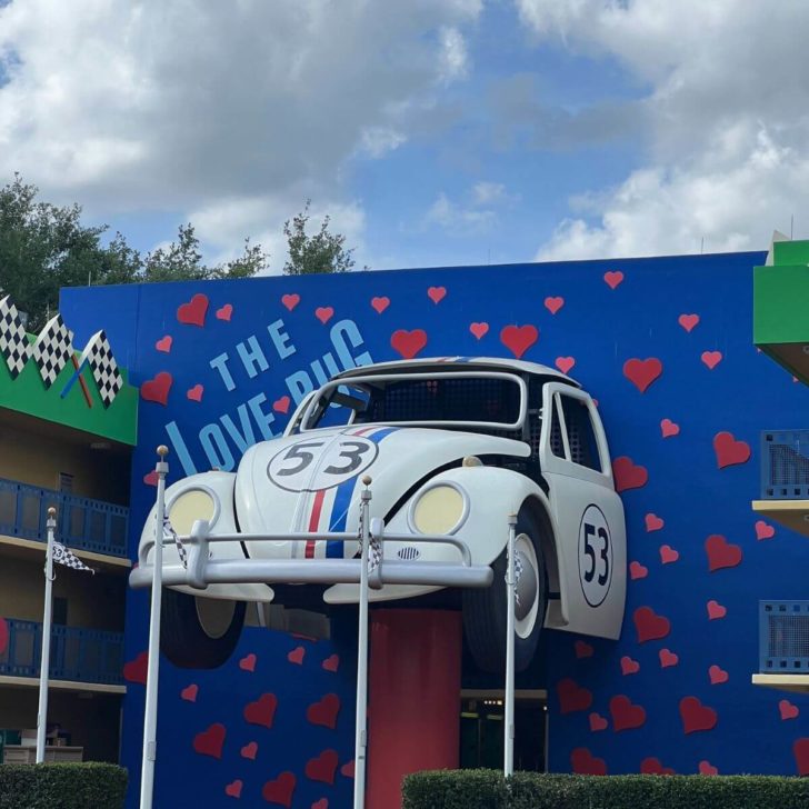 Photo of a giant replica of Herbie, the Love Bug, attached to one of the resort buildings at Disney's All-Star Movies Resort.