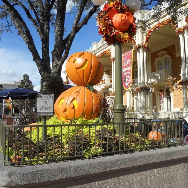 Photo of Halloween decorations at Magic Kingdom with the Town Square Theater building in the background.