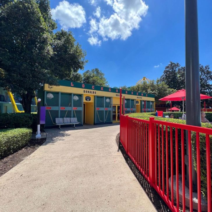 Photo of the walkway by the Duck Pond pool with the restrooms and laundry facilities in the background.