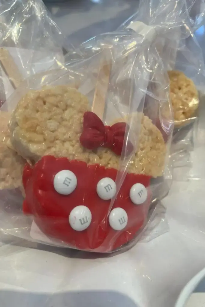 Photo of a Minnie Mouse themed crisped rice treat on a stick.