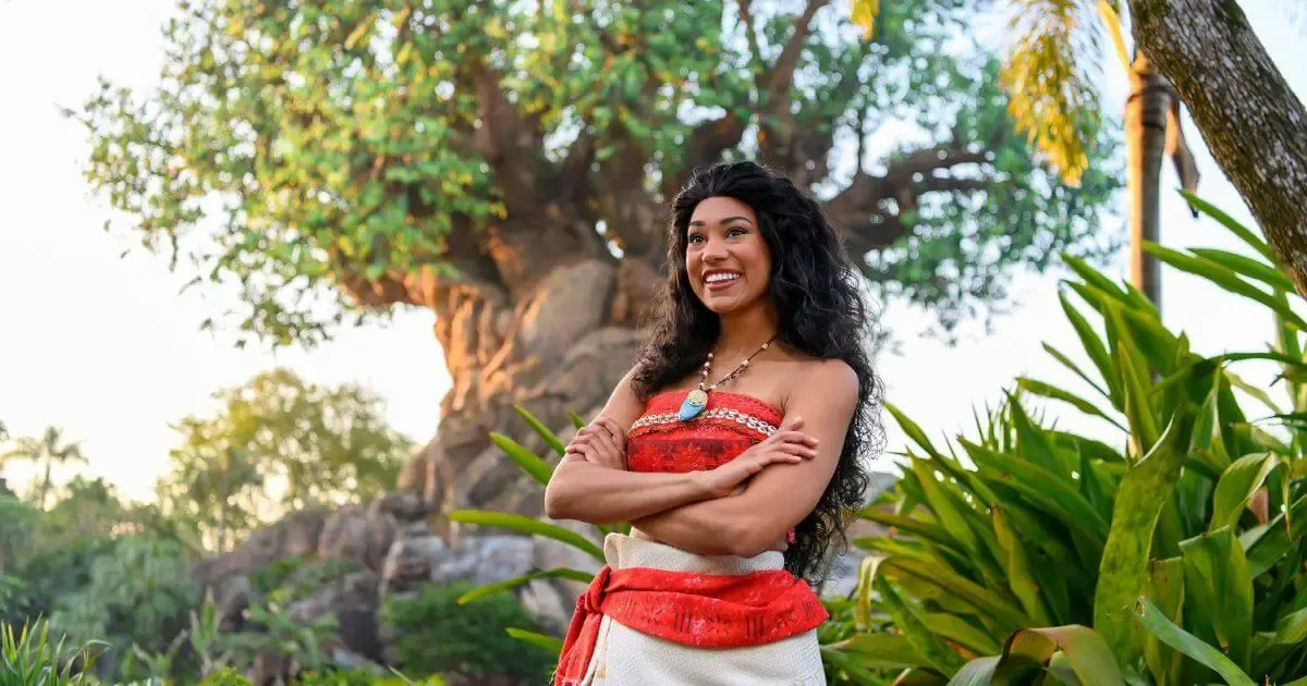 Horizontal photo of Moana at Disney World's Animal Kingdom with the Tree of Life in the background.