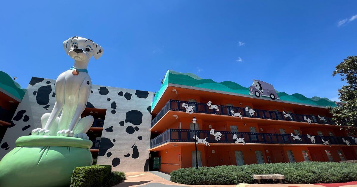 Photo of the 101 Dalmatian hotel room buildings with a giant statue of Perdita at Disney's All-Star Movies Resort.
