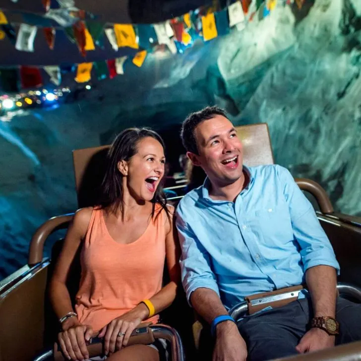 Photo of a man and woman screaming (happy) while riding Expedition Everest at Disney's Animal Kingdom theme park.