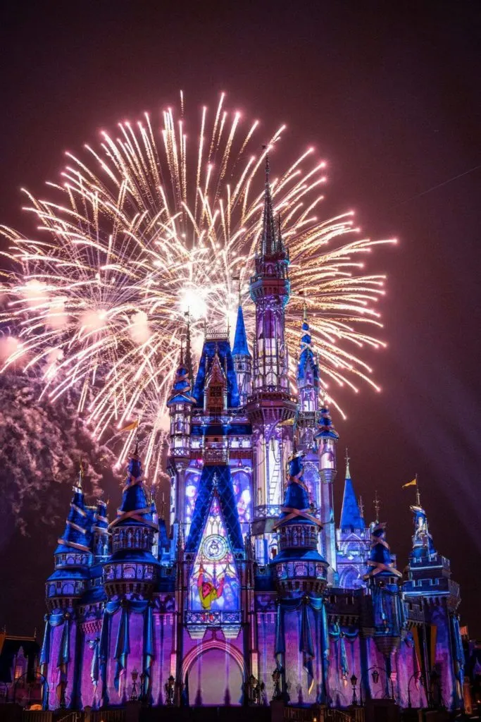 Photo of fireworks bursting behind Cinderella Castle during the Happily Ever After nighttime show at Magic Kingdom.