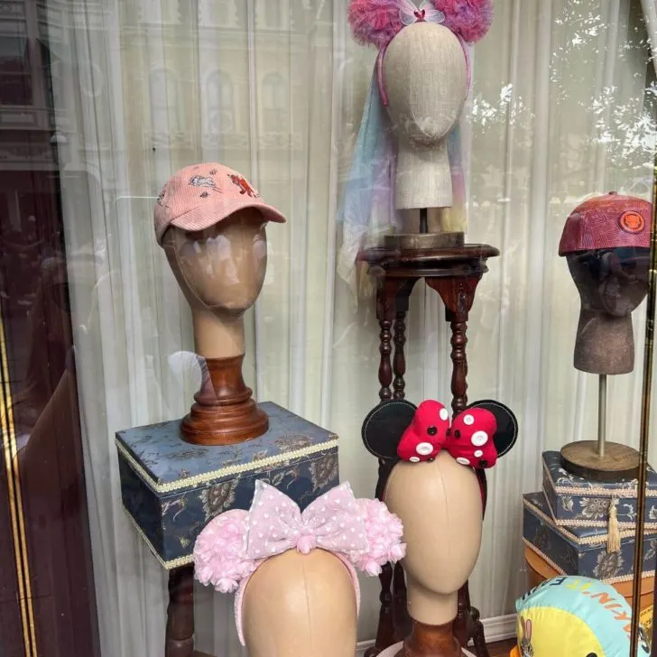 Photo of a merchandise display at a gift shop in Magic Kingdom, featuring Minnie Mouse ears and hats.